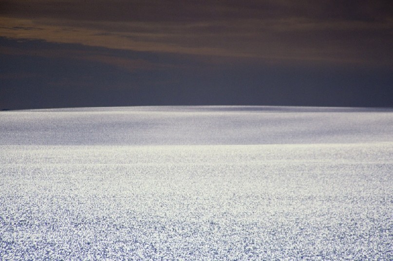 On the Antarctic Plateau, the ice shimmers in the midday sun.<br />
<br />
Over several kilometers thick, the ice here stretches many kilometres to the coast beyond the horizon.<br />
<br />
Like desert travel with minimal features, travel over the ice in Antarctica requires careful route finding skills, or for those more fortunate, a line of flag canes melted into the ice to guide the way.