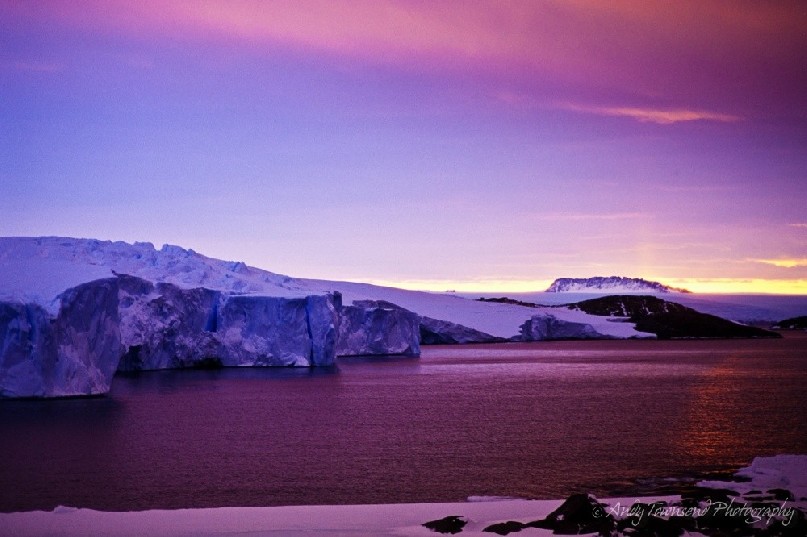 Looking north from Mawson Station to the Casey Range, a small solar pilar is visible. Mawson Station is a permanent base in Antarctica managed by the Australian Antarctic Division (AAD). It is named after the explorer, Douglas Mawson. Mawson station is Australia's oldest Antarctic station and the oldest continuously inhabited Antarctic station of any nation below the Antarctic Circle.