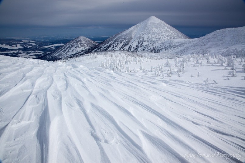 Wind scouring creates patterns in the snow towards Mt Takada Odake and Mt Hindake.