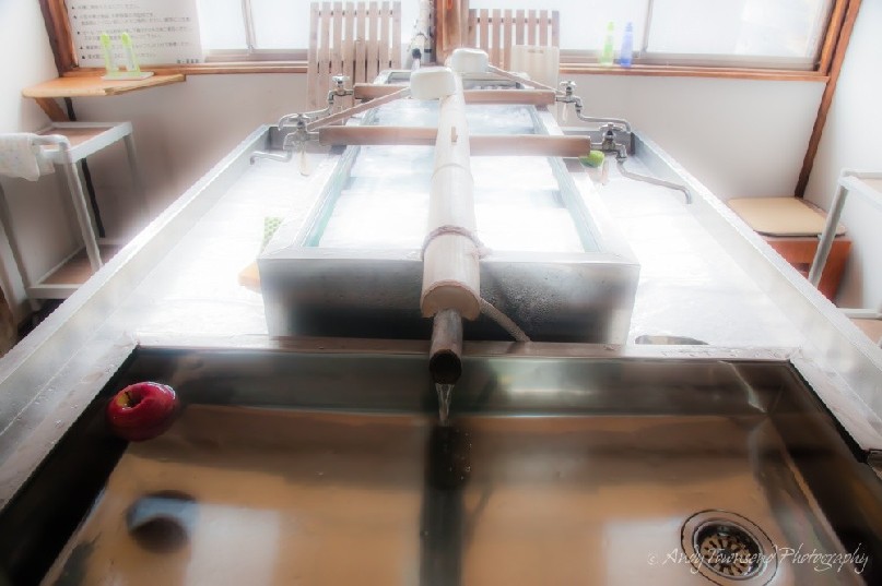A typical kitchen with constant running water from the natural springs surrounding the onsen.