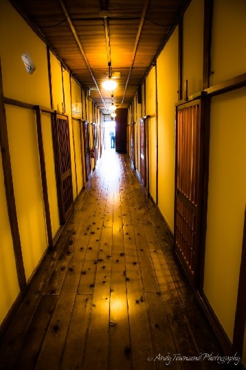 One of many uneven corridors leading through the ryokan with rooms off either side.