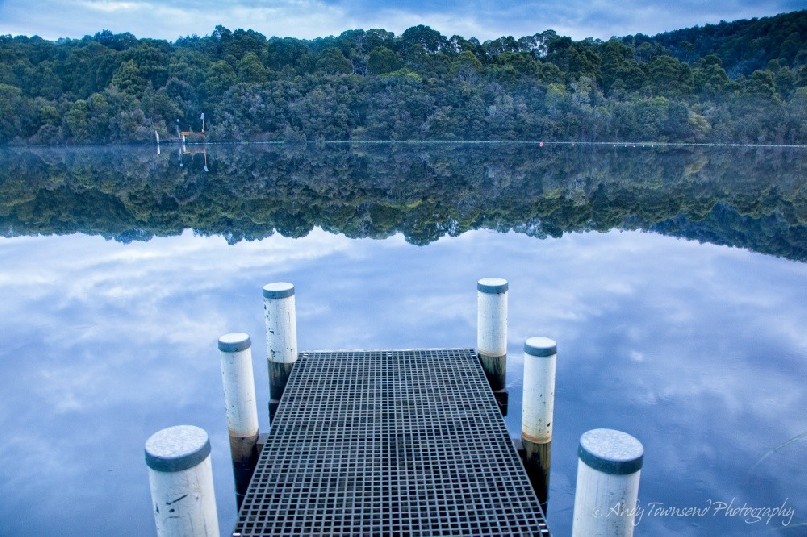 A small jetty juts out over the Pieman River.