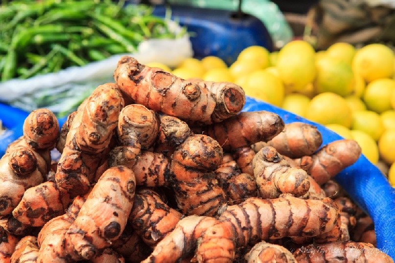 A closeup of turmeric root at a wholesale vegetable market in Delhi.