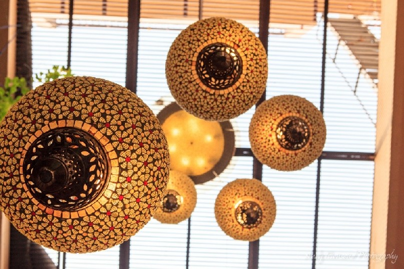 View up through ornate lights and skylight in an old Haveli.