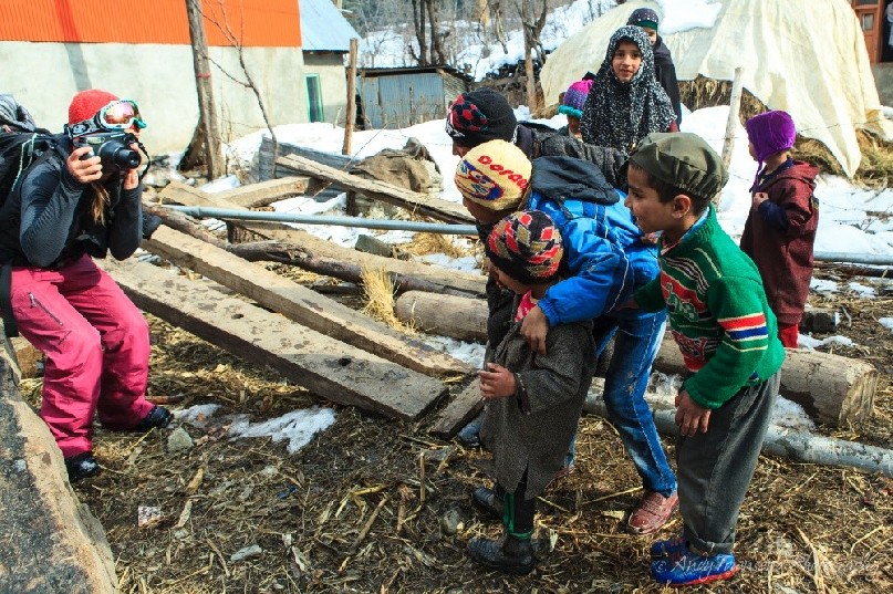 Drung village kids line up for a polaroid photo of themselves.