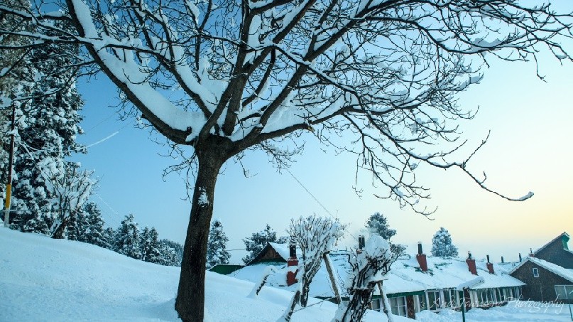 The glow of sunrise over the hotel after an overnight snowfall.