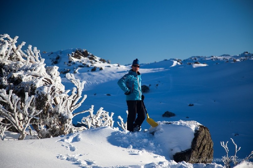 A back-country skier takes a break while shoveling out the perfect cooking platform in the N.S.W high country, Kosciuszko National Park, Australia.