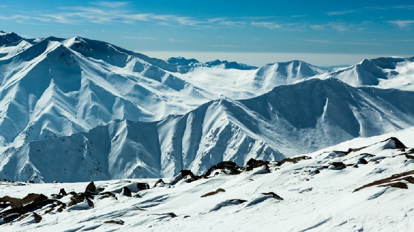 Looking towards the border of Pakistan over mountain ridgetops.