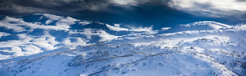 A storm builds on the western edge of the Main Range providing unusual lighting, Kosciuszko National Park, Australia