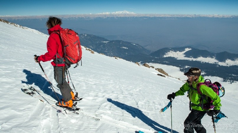 Two skiers make their way up to Mt Apharwat.