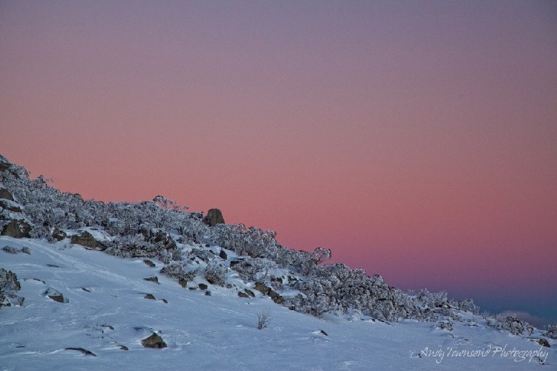 Soft pastel colours light up the sky after sunset near Spencers Creek, Kosciuszko National Park, Australia.