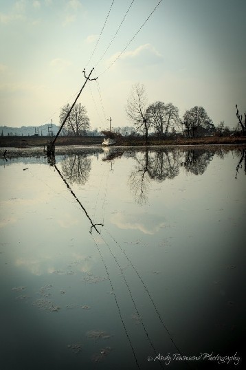 Powerlines reflecting into Dal Lake.