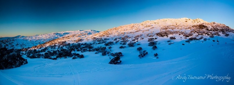 The last of the sun's rays brush over the range near The Paralyser, Kosciuszko National Park, Australia.